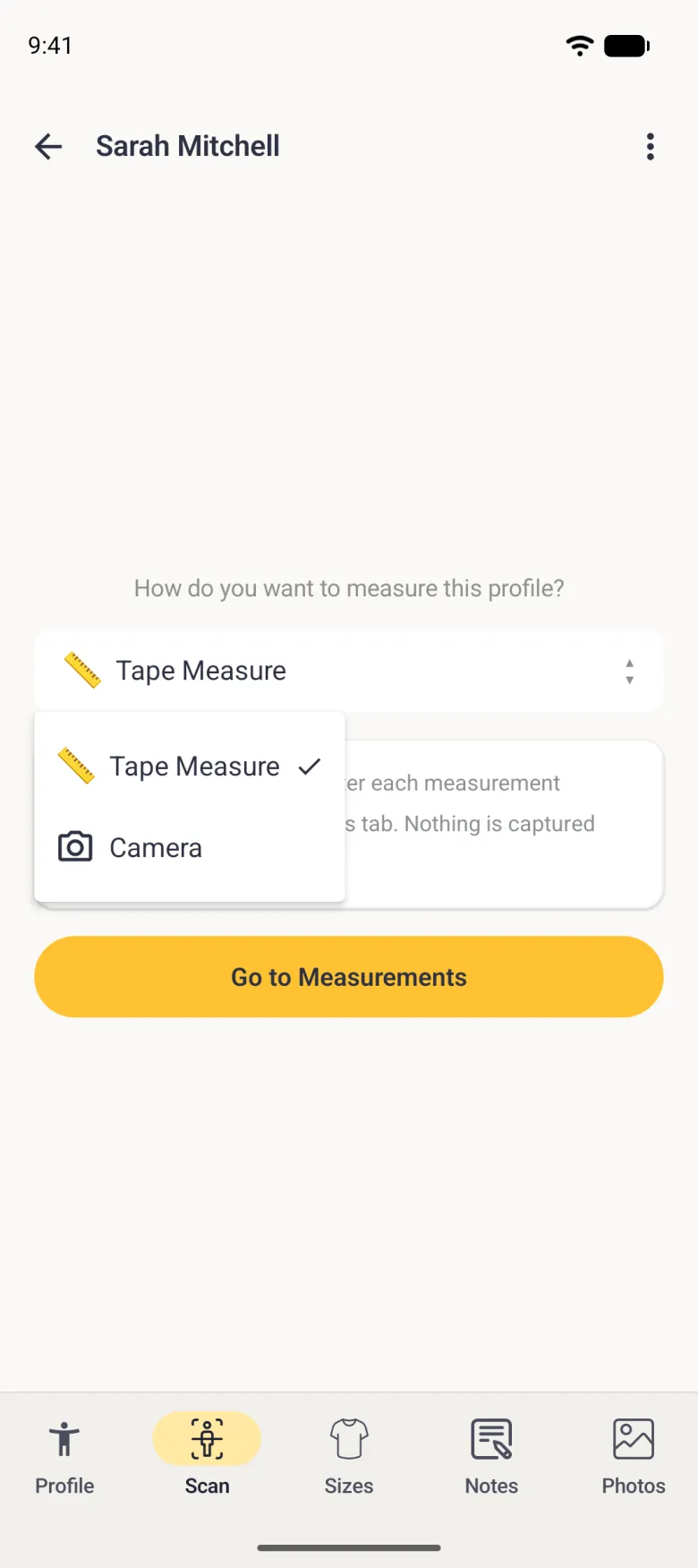 A Scan tab with the measuring mode dropdown open under How do you want to measure this profile?, listing Tape Measure with a tick and Camera with a camera icon, above the yellow Go to Measurements button.