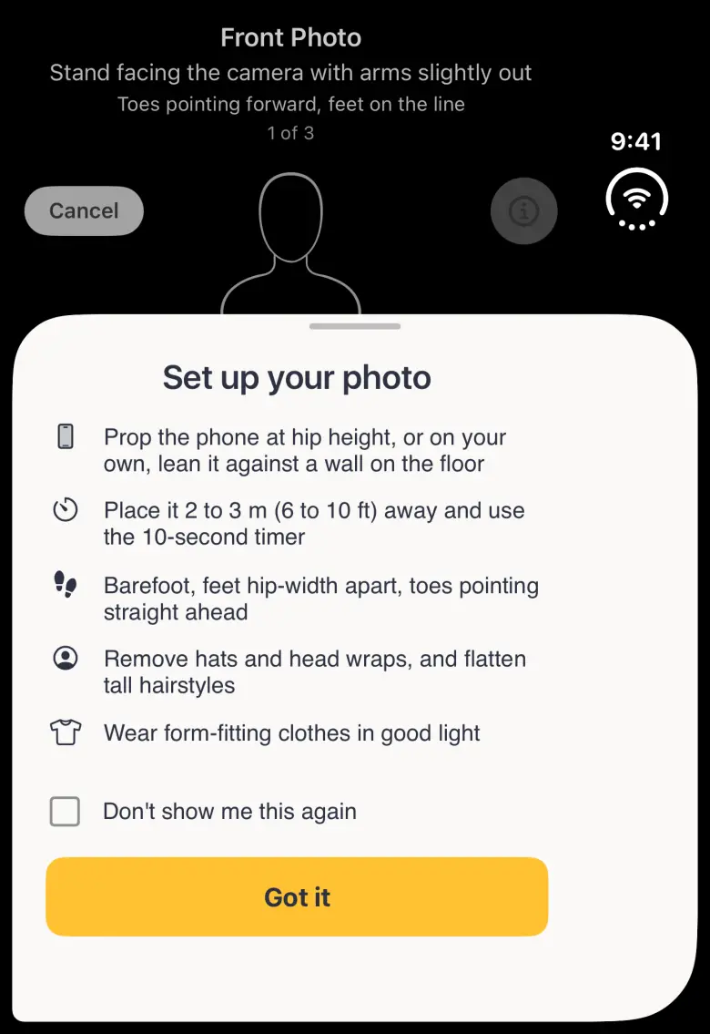 A Set up your photo sheet with a grabber over the lower two thirds of the black camera screen on the closed Duo, listing all five tips with small icons (prop the phone at hip height or lean it on a wall, stand 2 to 3 metres away and use the 10-second timer, barefoot with feet hip-width apart and toes straight ahead, remove hats and flatten tall hairstyles, wear form-fitting clothes in good light), an unticked Don't show me this again checkbox and a gold Got it button; above it the Front Photo banner reading 1 of 3, Cancel, the dimmed info button and the head of the line-art body guide, with 9:41 and Wi-Fi in the strip on the right.