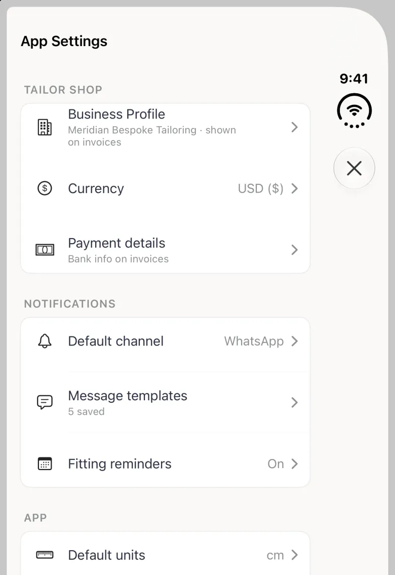 App Settings sheet on the closed iPhone Duo, with its close button (a cross) in the vertical bar strip on the right edge under the 9:41 status stack, and plain monochrome row icons: Business Profile (Meridian Bespoke Tailoring, shown on invoices), Currency USD ($) and Payment details (Bank info on invoices) under TAILOR SHOP, then Default channel WhatsApp, Message templates 5 saved and Fitting reminders On under NOTIFICATIONS, and the APP section beginning with Default units cm at the bottom edge.