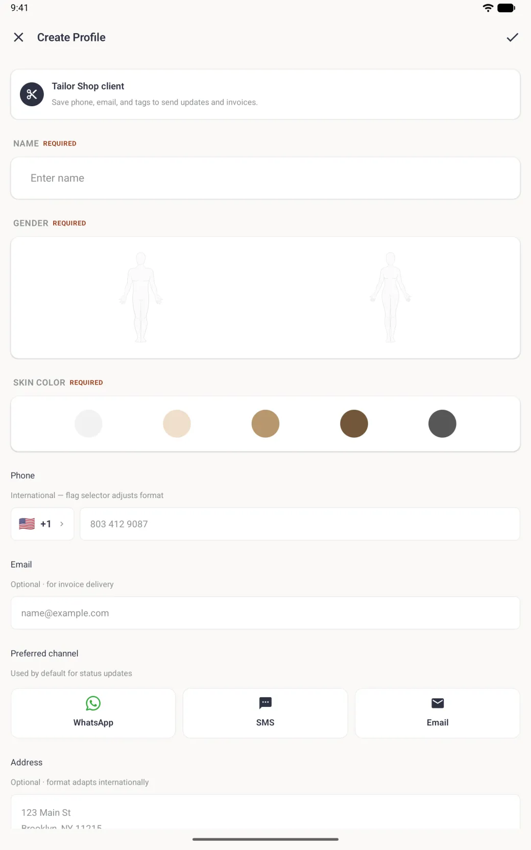Create Profile form filling the tablet in portrait, with an X and a tick in the top bar, a Tailor Shop client banner, an empty name field, a wide panel with man and woman outlines, five skin tone circles, a phone field with a US flag and +1 selector, email, WhatsApp, SMS and Email channel cards, and the top of the address box.