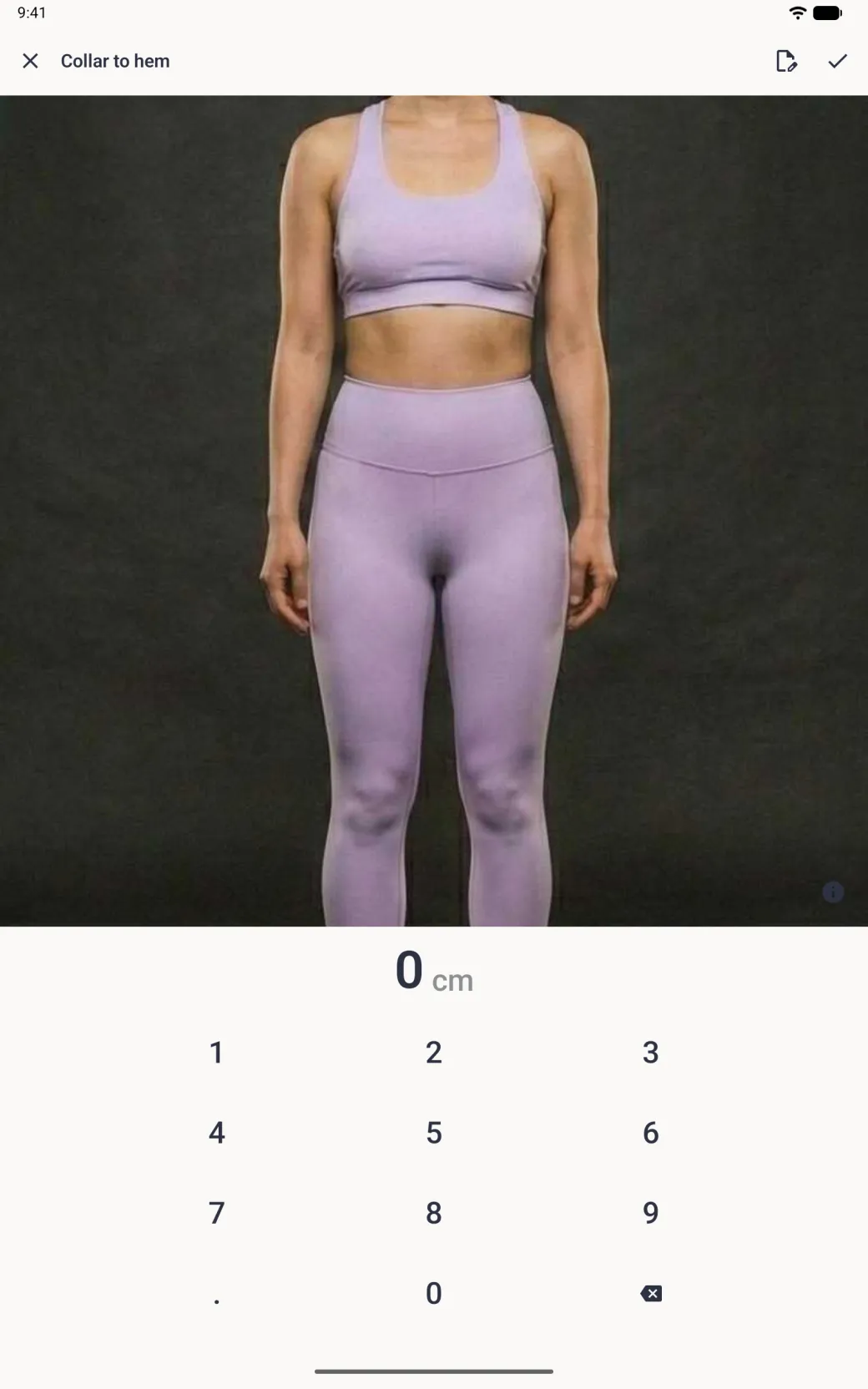 An entry screen titled Collar to hem with the chosen photo of a woman in lilac sportswear filling the top half, cropped from the shoulders to the knees, a small information button at its bottom right, the value 0 cm and a full-width number pad, with an edit button and a checkmark in the top bar.