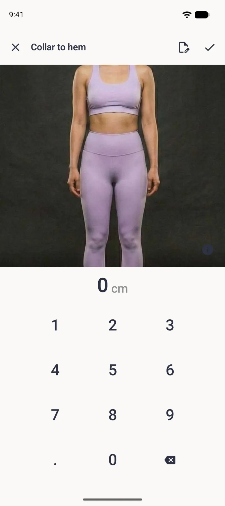 An entry screen titled Collar to hem showing the photo the tailor chose, a navy information button, the value 0 cm and the number pad, with an edit button and a checkmark in the top bar.