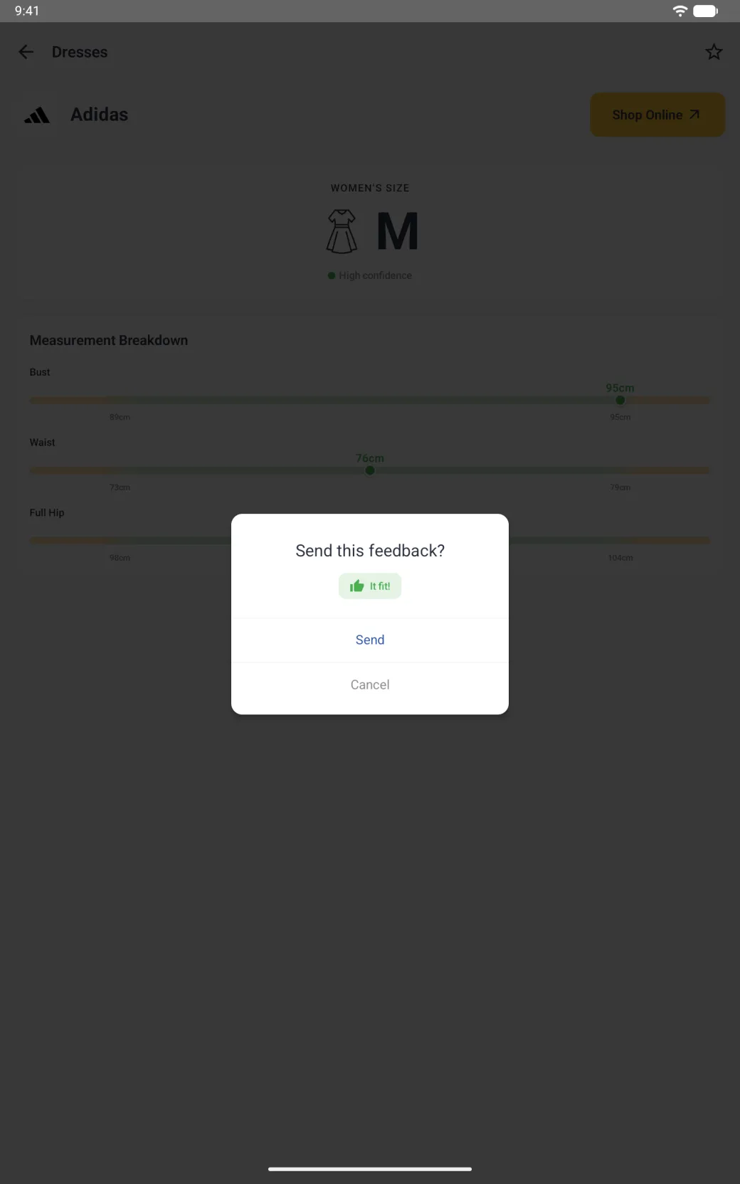 A small white dialog centred over the dimmed Adidas page titled Send this feedback? with a small green It fit! chip, a blue Send button and a grey Cancel button separated by thin lines.
