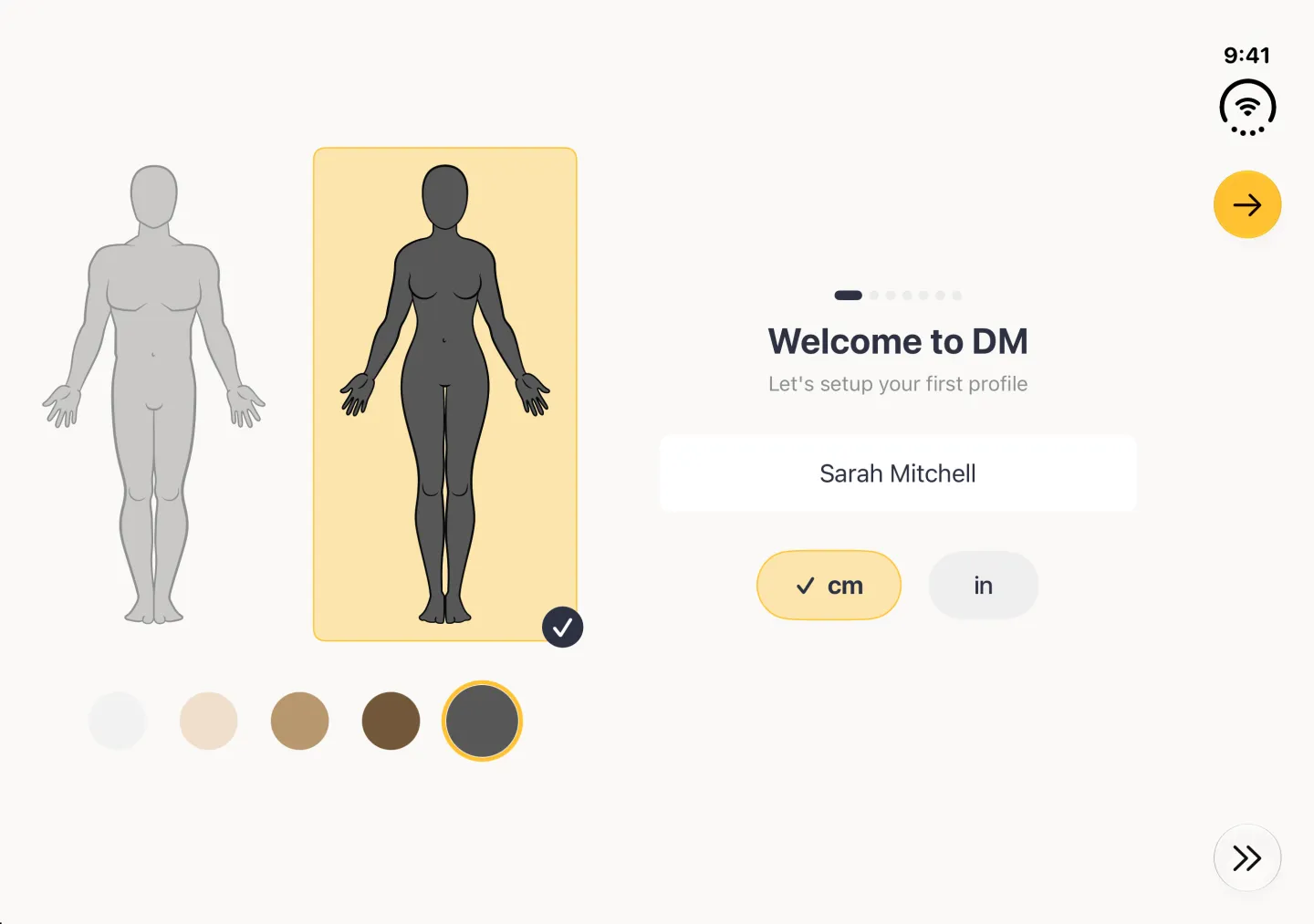 Welcome to DM screen in landscape with the woman outline in the darkest (charcoal) skin tone highlighted in gold on the left, the charcoal tone circle ringed in gold below it, the name Sarah Mitchell and cm ticked in a gold pill on the right, and the Continue arrow button in the vertical bar strip now gold.