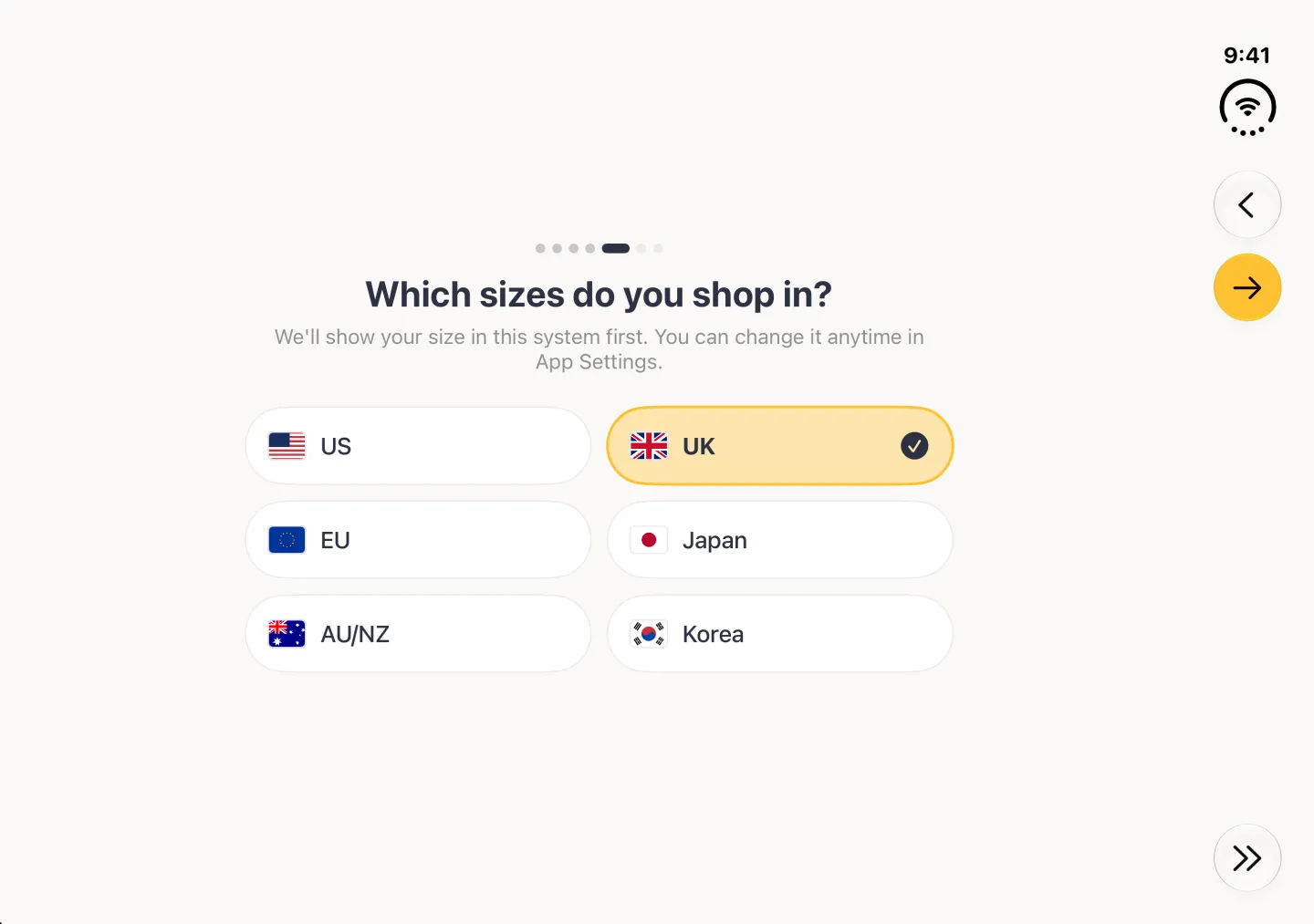 Which sizes do you shop in? step in landscape with six wide region buttons in two columns, US, UK, EU, Japan, AU/NZ and Korea, each with its flag, and UK highlighted in gold with a navy tick; Back, a gold Continue arrow and Skip sit in the vertical bar strip on the right edge.