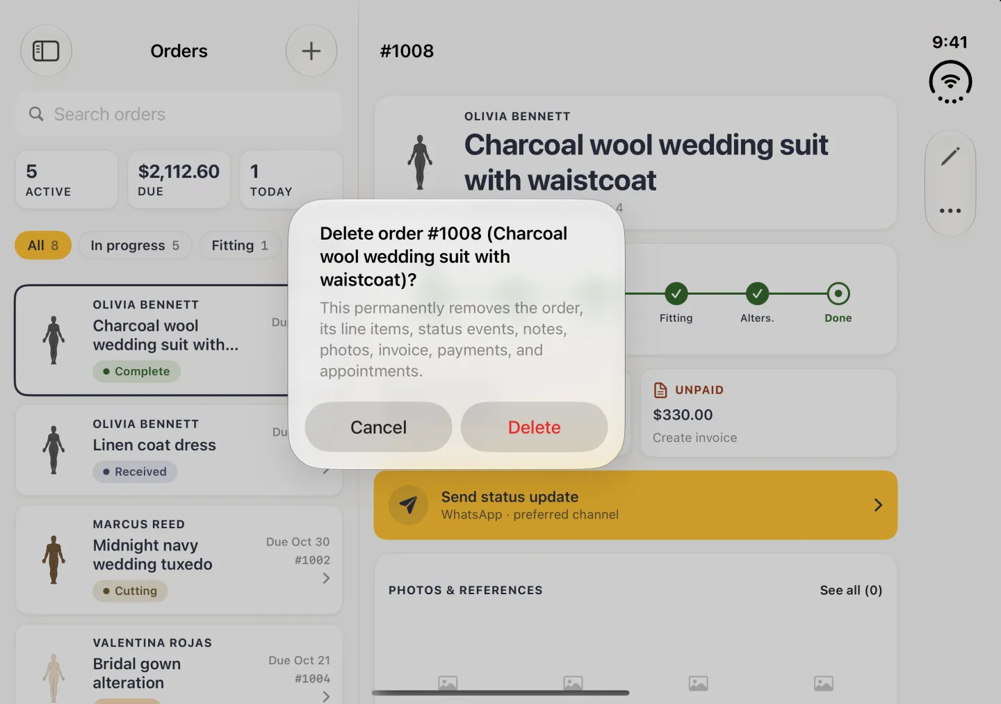 Alert centred over the dimmed Orders column and order #1008 in landscape, titled Delete order #1008 (Charcoal wool wedding suit with waistcoat)?, explaining that this permanently removes the order, its line items, status events, notes, photos, invoice, payments and appointments, with Cancel and a red Delete button.