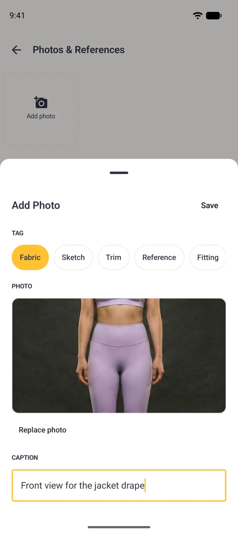 Add Photo sheet with the Fabric tag selected, a front-on body photo filling the preview, a Replace photo link and a caption reading Front view for the jacket drape.