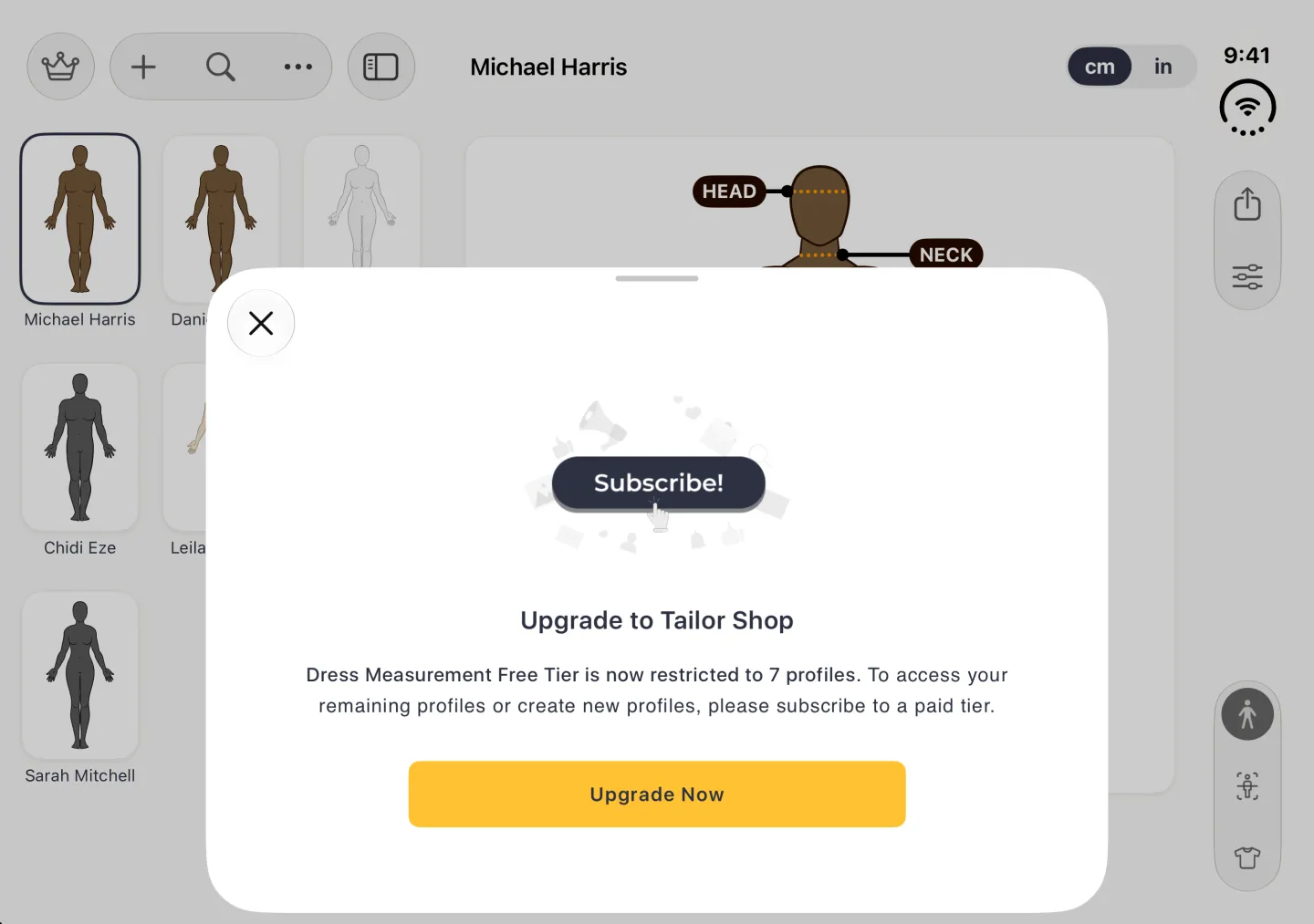 Upgrade to Tailor Shop sheet rising over the dimmed split view in landscape, with a grab handle and a close button at its top left, a Subscribe! illustration, text explaining that the free tier is restricted to 7 profiles, and a wide gold Upgrade Now button; the profile grid and Michael Harris's profile show dimmed behind it.