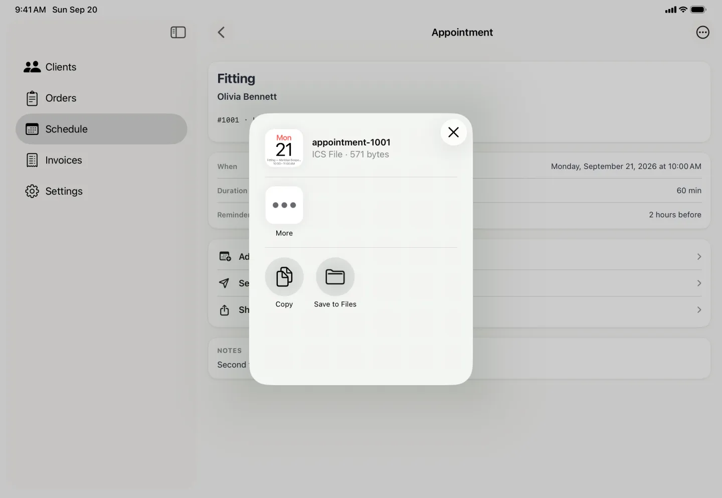 Share popover over the dimmed Appointment detail, headed appointment-1001, ICS File, 571 bytes, with a small calendar page preview showing Monday 21 and the fitting from 10:00 to 11:00 AM, a More button, and Copy and Save to Files underneath.