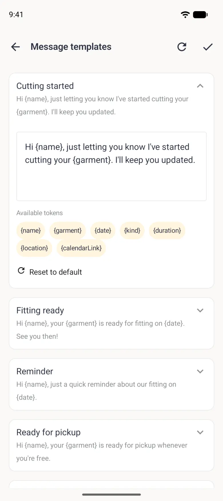 The Cutting started template opened, with its wording in an editable box, an Available tokens row of pale gold chips reading name, garment, date, kind, duration, location and calendarLink, and a Reset to default link.