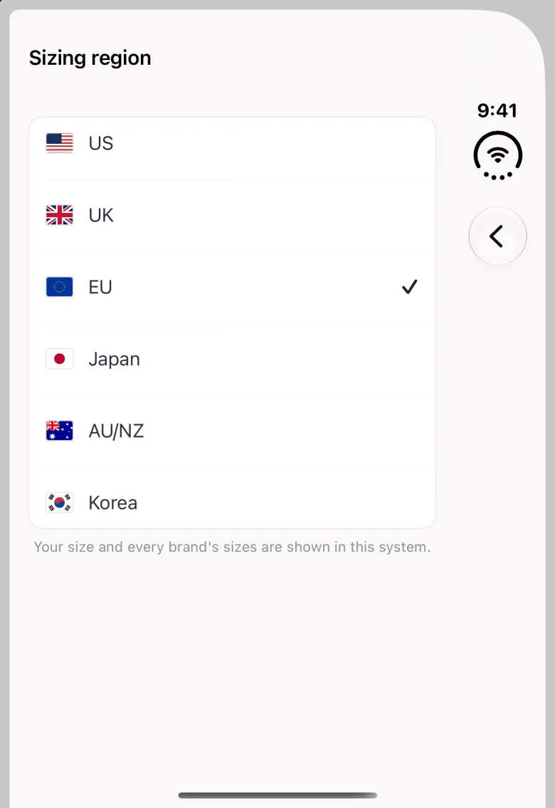 Sizing region page on the closed Duo with the title at the top left and a back button in the vertical bar strip on the right, and a white card with six rows, US, UK, EU, Japan, AU/NZ and Korea, each with its flag, EU ticked, above the note Your size and every brand's sizes are shown in this system.