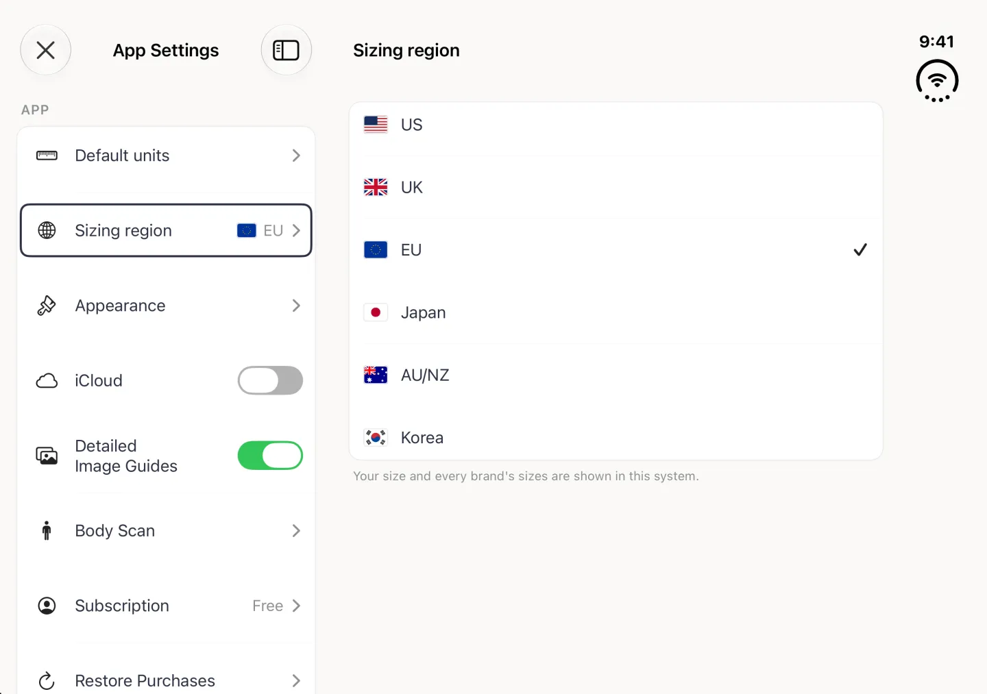 App Settings split view in landscape with the Sizing region row selected on the left, now showing an EU flag and EU, and the Sizing region page on the right: a white card with six rows, US, UK, EU, Japan, AU/NZ and Korea, each with its flag, EU ticked, above the note Your size and every brand's sizes are shown in this system.