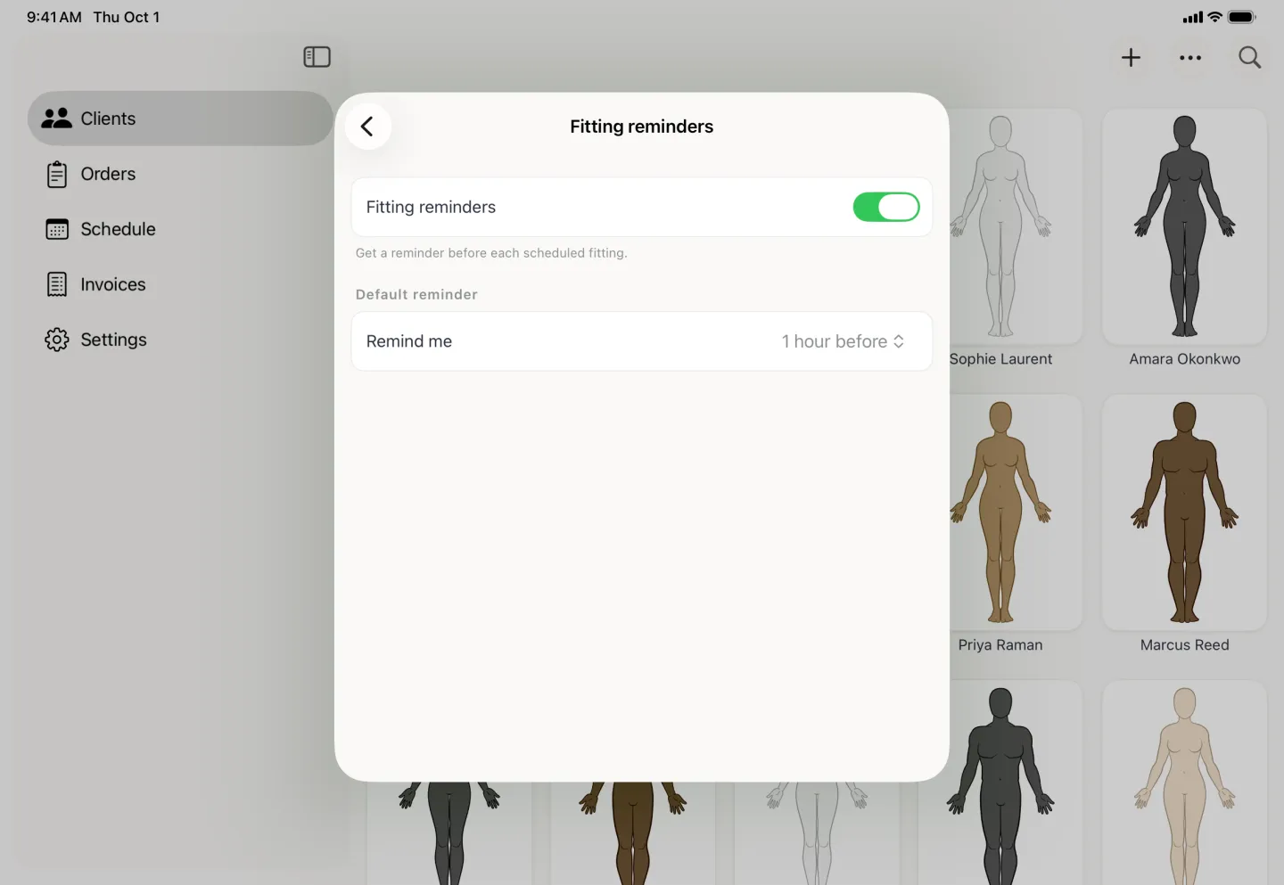 Fitting reminders card with the reminders toggle switched on in gold above the line Get a reminder before each scheduled fitting, and a Default reminder group whose Remind me row reads 1 hour before.