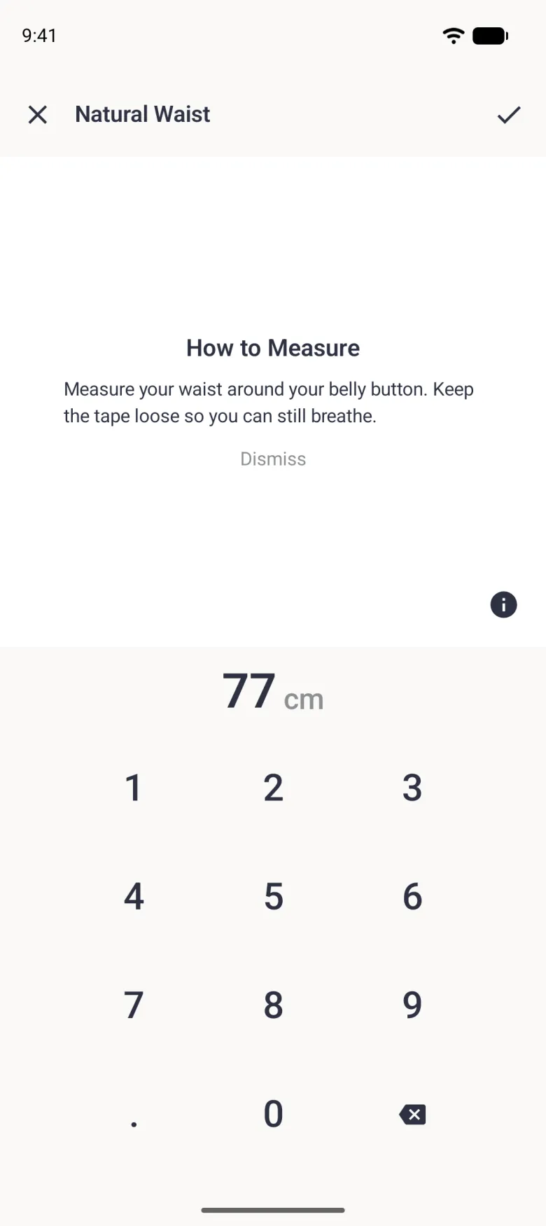 A How to Measure panel on white reading Measure your waist around your belly button. Keep the tape loose so you can still breathe, with a grey Dismiss link centred under the text, above the 77 cm value and the number pad.